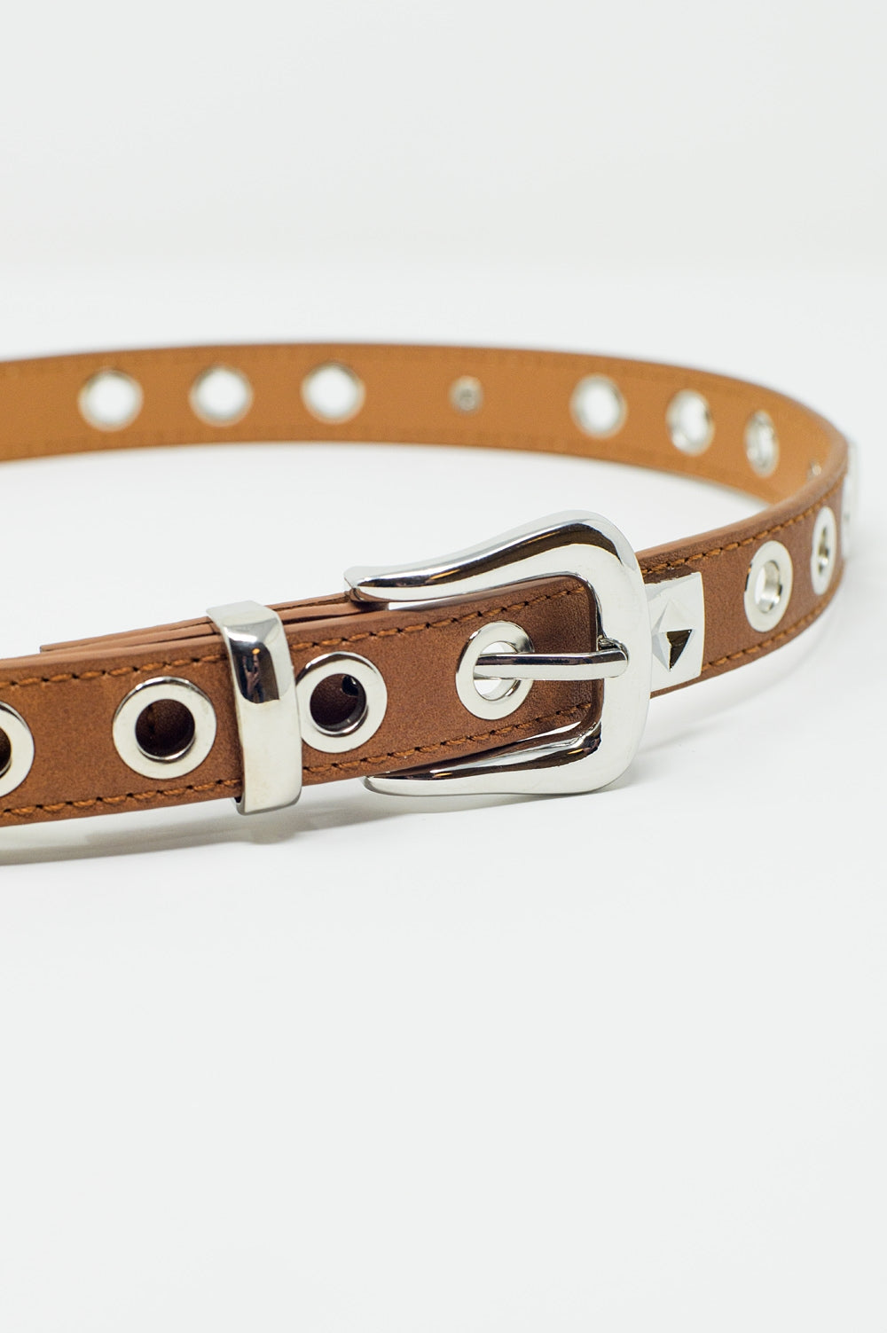 Thin brown leather belt with silver details