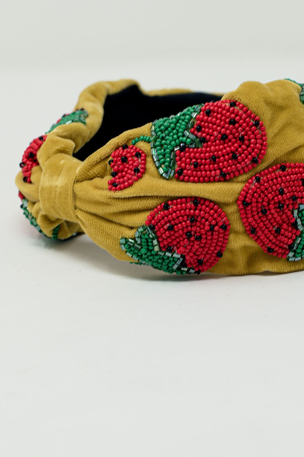 Velvet headband with strawberry-shaped bead embellishments