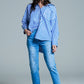 White oversized blouse with vertical stripes in blue and chest pocket