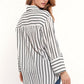 White shirt with black stripes and chest pockets