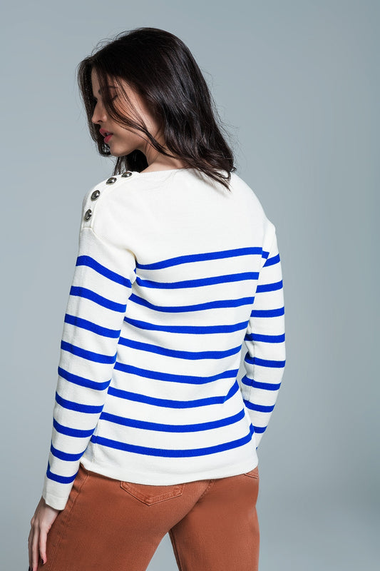White sweater with buttons on shoulders and blue stripes