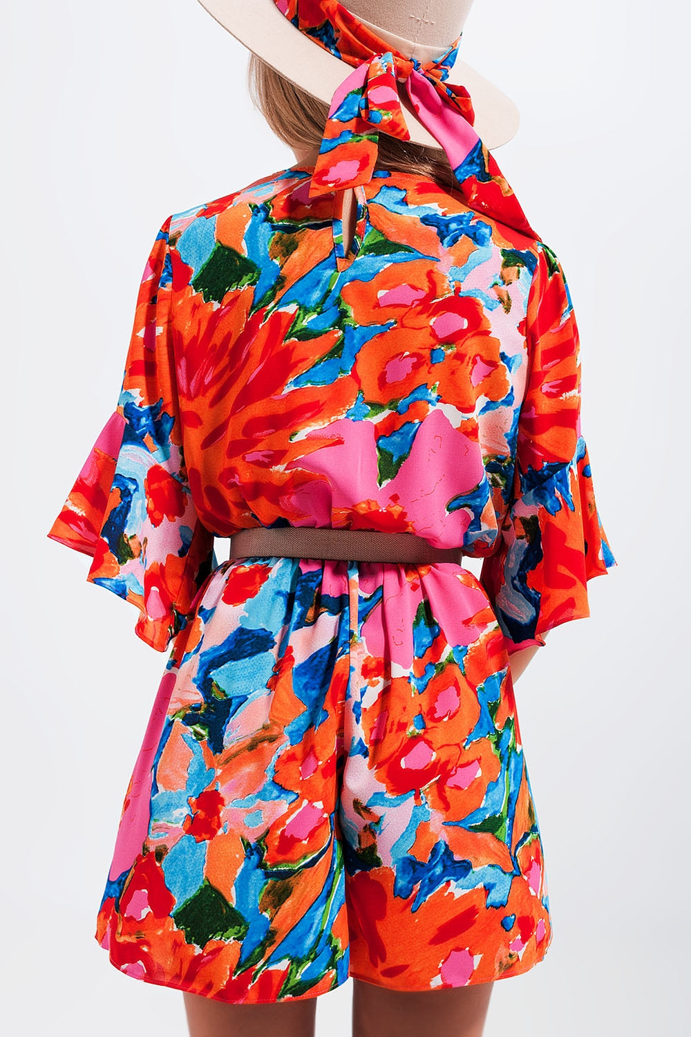 Wrap playsuit in floral Szua Store